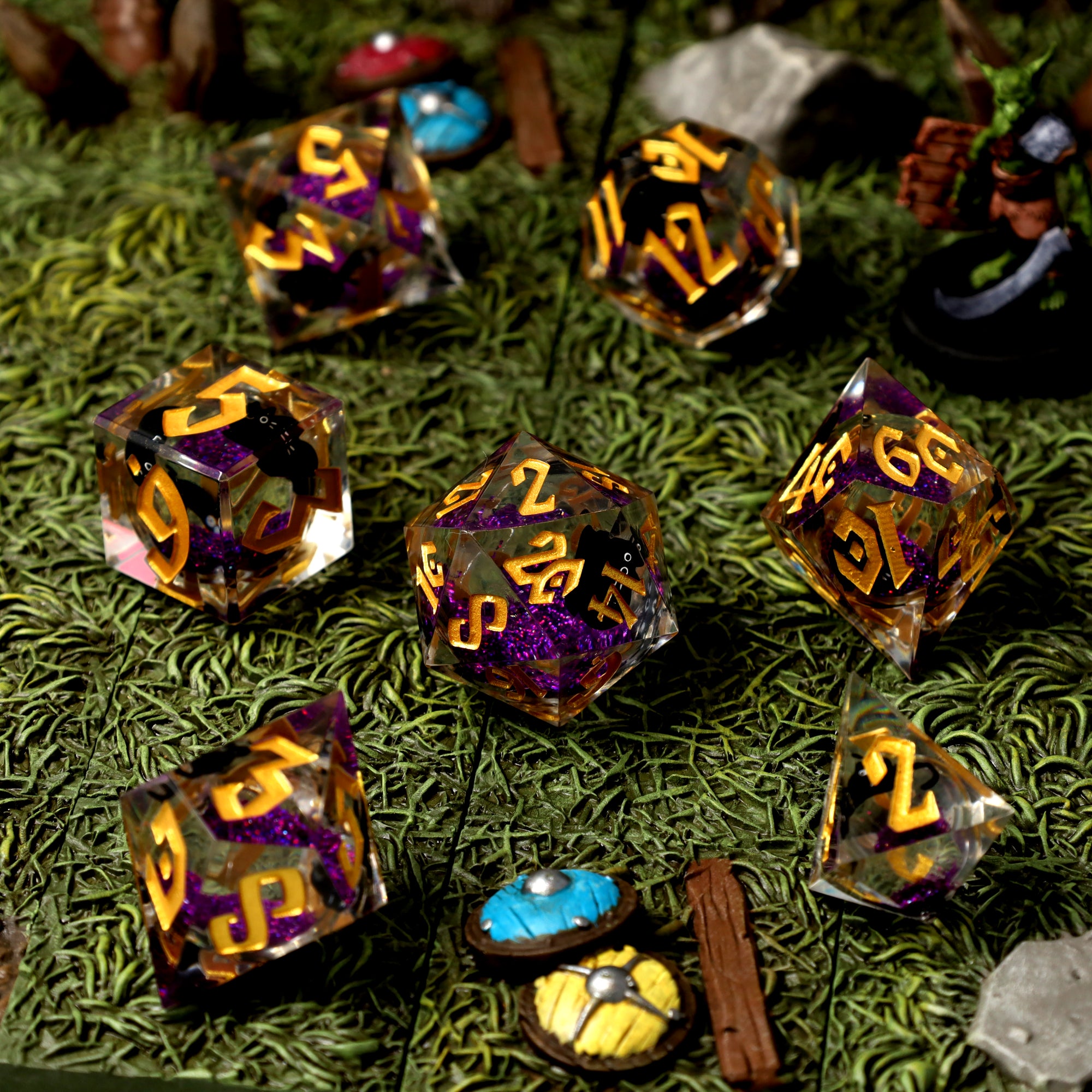 Cantrip Kittens Amethyst dice on a mossy battle map