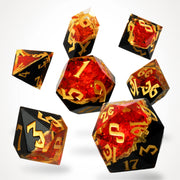 Gemcutter's Ruby geode dice set, black stone with ruby-red crystal core, full 7-piece spread