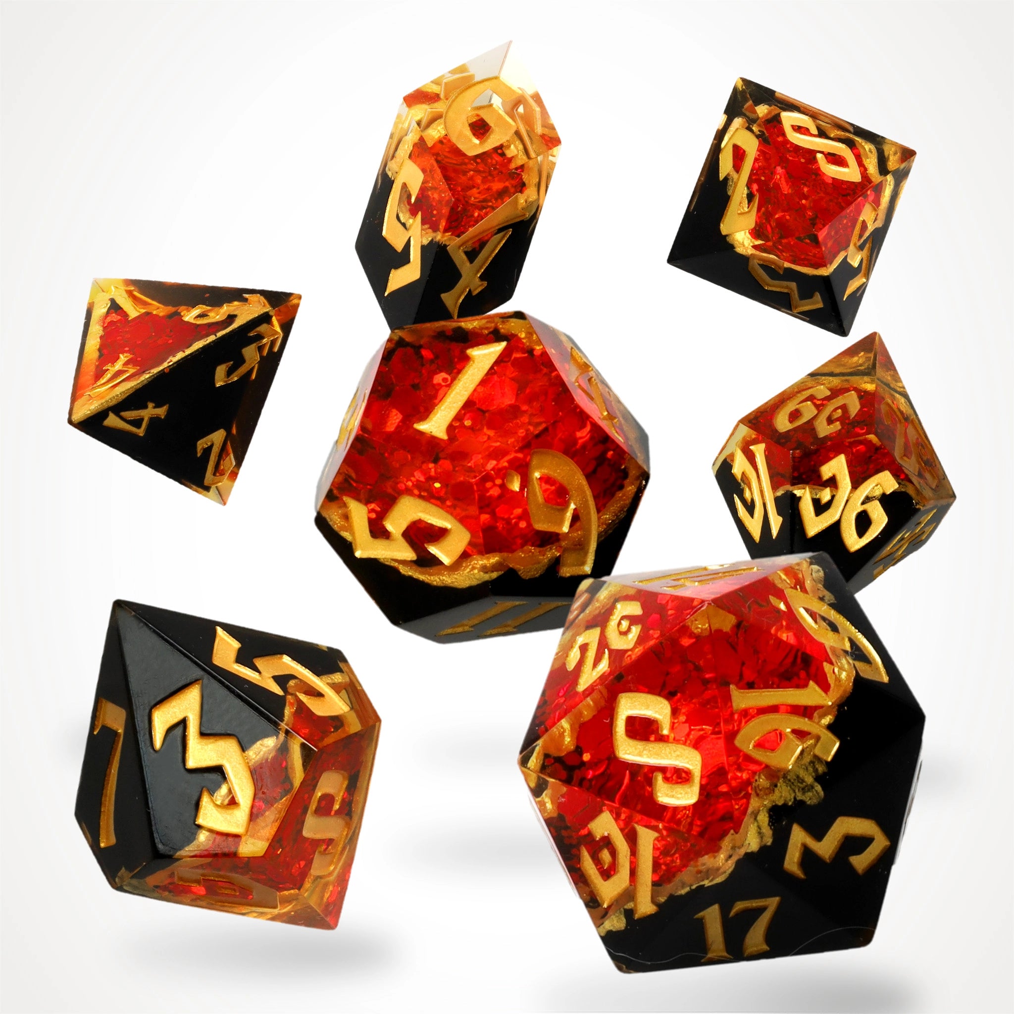 Gemcutter's Ruby geode dice set, black stone with ruby-red crystal core, full 7-piece spread