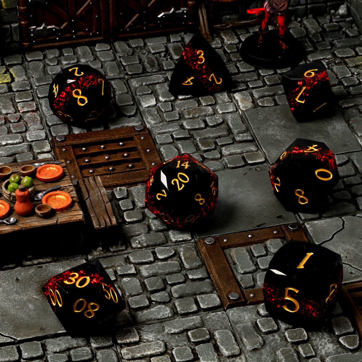 Sanguine Seam Resin RPG Dice Set on a dungeon tabletop