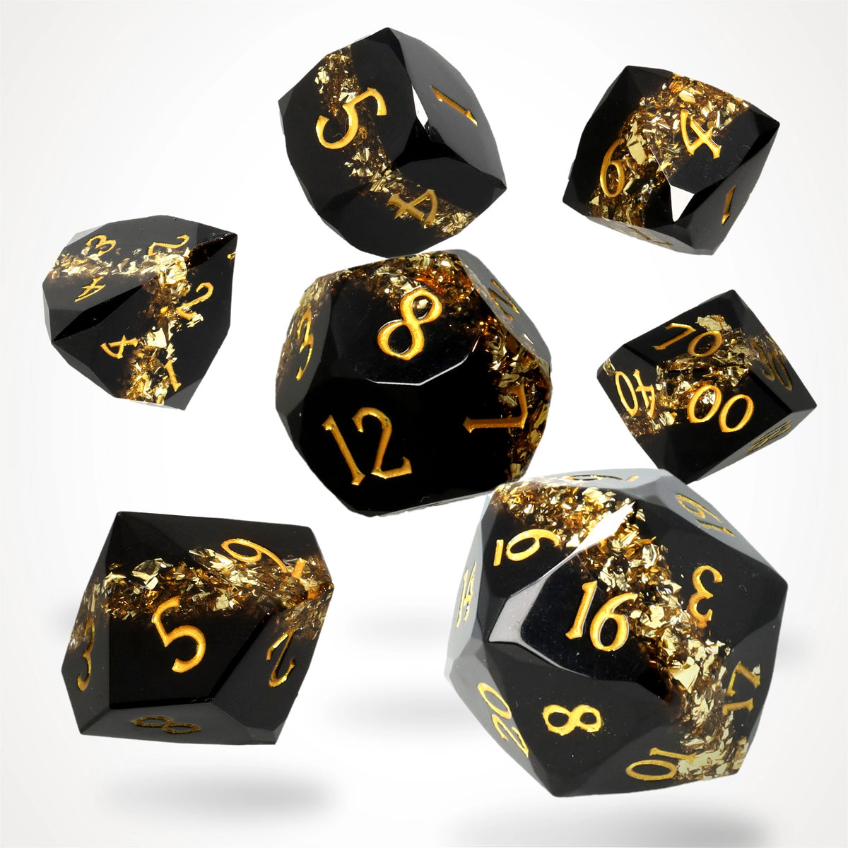 Topaz Trail Resin RPG Dice Set: seven black gem-cut resin dice with a gold mica band and gold numbers