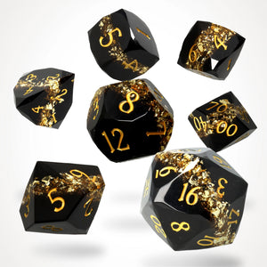 Topaz Trail Resin RPG Dice Set: seven black gem-cut resin dice with a gold mica band and gold numbers